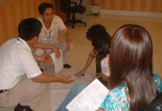 Participants writing on flipchart